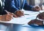 Firefly_Accounting & Legal, Permits, Government Documents realistic people signing documents 430733
